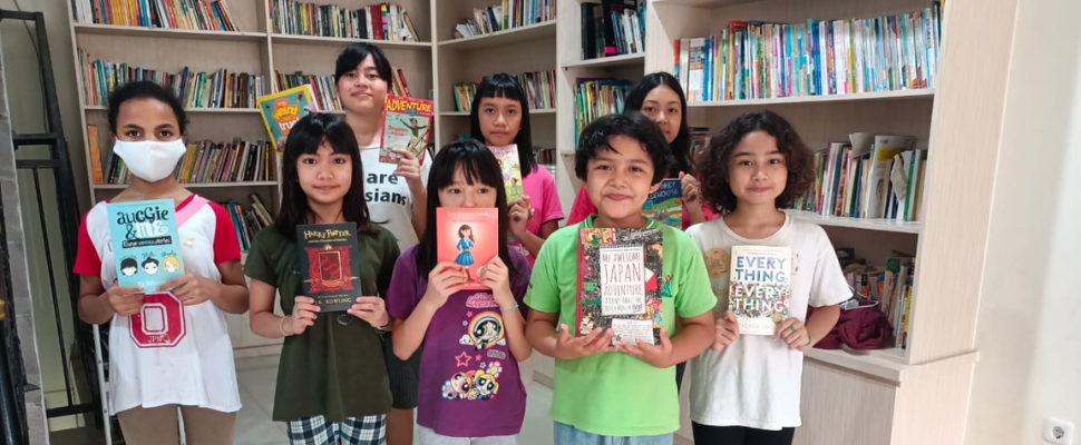 Happy  kids at Dorkas - an orphanage for girls. They just got donations boxes of books that they cannot wait to read